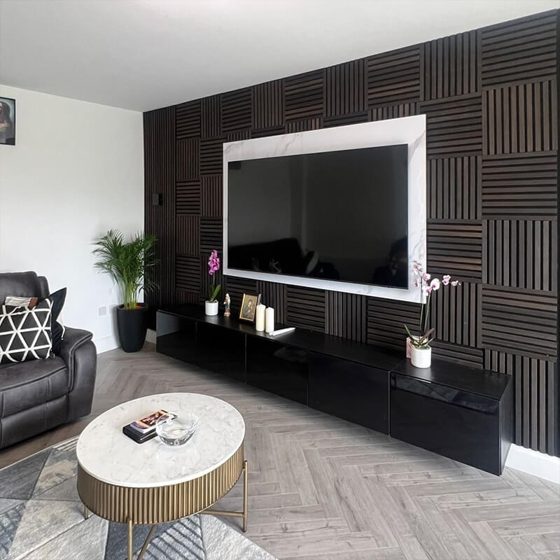 Installation of soundproofing panels to reduce neighbor noise through walls